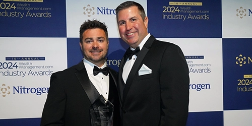 Home 12 Advyzon Employees pictured after accepting a 2024 WealthManagement.com Industry Award.