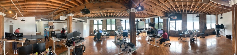 Advyzon Story 1 Early Advyzon office with startup team working.
